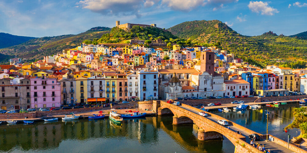 Aerial,View,Of,The,Beautiful,Village,Of,Bosa,With,Colored